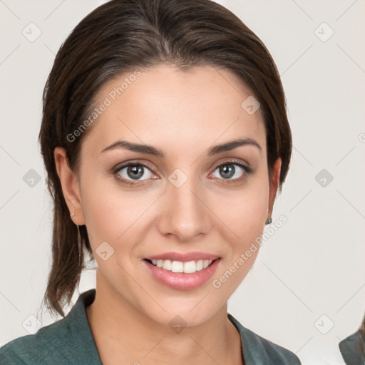 Joyful white young-adult female with medium  brown hair and grey eyes