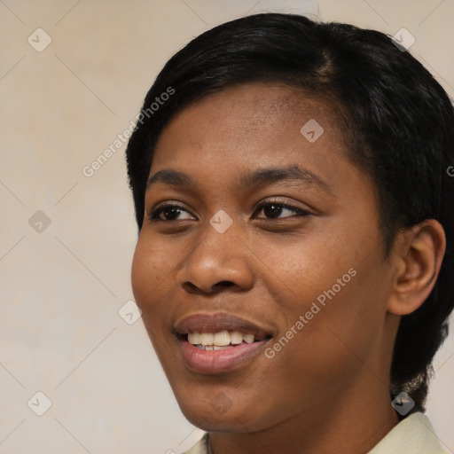 Joyful black young-adult female with short  black hair and brown eyes