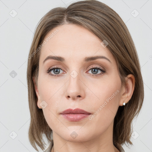 Neutral white young-adult female with medium  brown hair and grey eyes