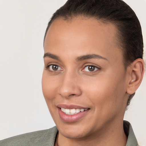 Joyful white young-adult female with short  brown hair and brown eyes