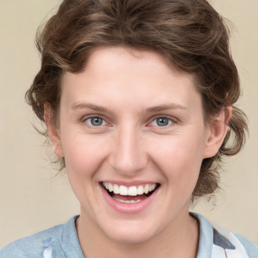 Joyful white young-adult female with medium  brown hair and blue eyes