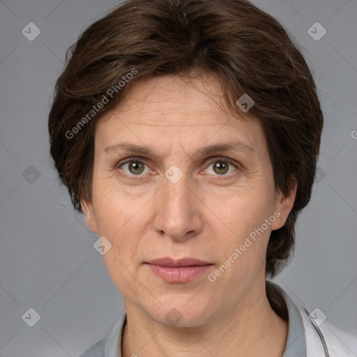 Joyful white adult female with medium  brown hair and grey eyes