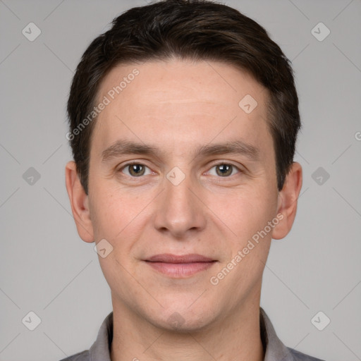 Joyful white young-adult male with short  brown hair and brown eyes