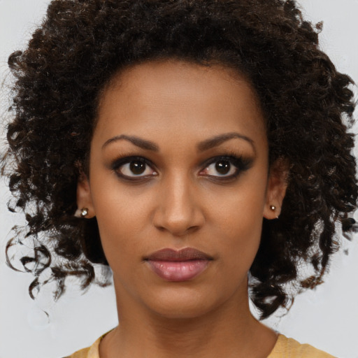 Neutral black young-adult female with medium  brown hair and brown eyes