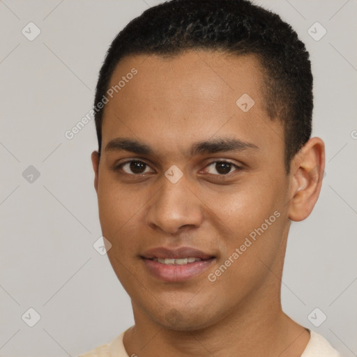 Joyful black young-adult male with short  brown hair and brown eyes