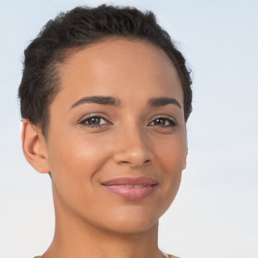 Joyful latino young-adult female with short  brown hair and brown eyes