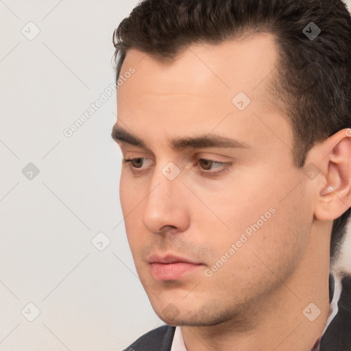 Neutral white young-adult male with short  brown hair and brown eyes