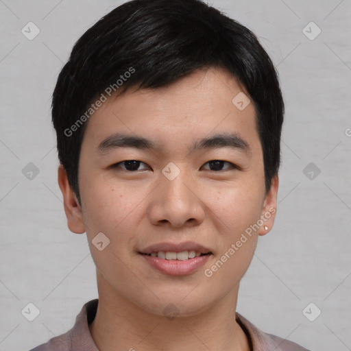 Joyful asian young-adult male with short  black hair and brown eyes