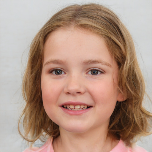 Joyful white child female with medium  brown hair and brown eyes