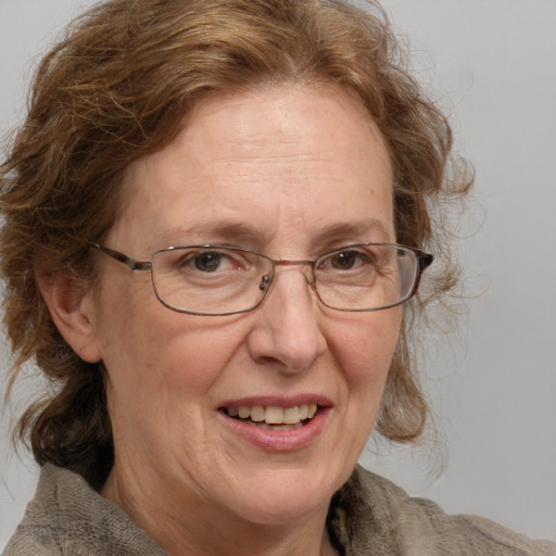 Joyful white middle-aged female with medium  brown hair and grey eyes