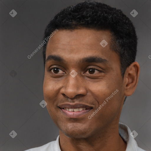 Joyful black young-adult male with short  black hair and brown eyes