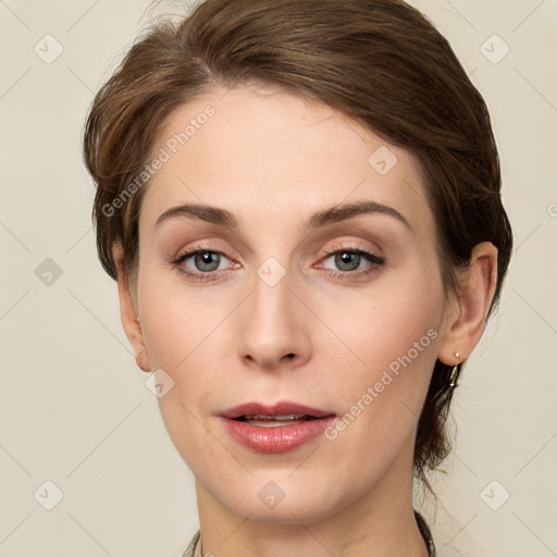 Joyful white young-adult female with medium  brown hair and green eyes