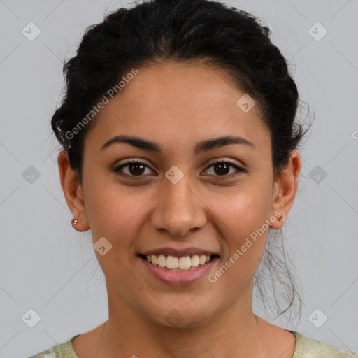 Joyful latino young-adult female with short  brown hair and brown eyes