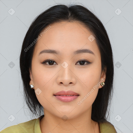 Joyful asian young-adult female with medium  black hair and brown eyes