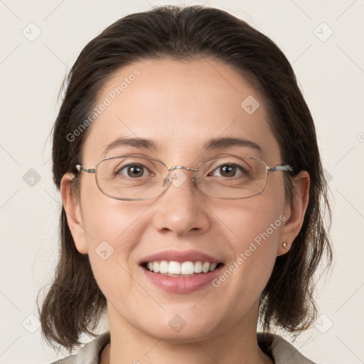 Joyful white young-adult female with medium  brown hair and grey eyes