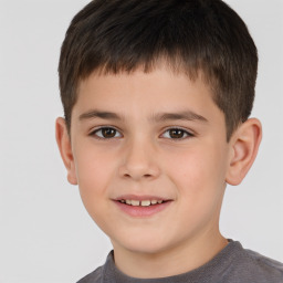 Joyful white child male with short  brown hair and brown eyes