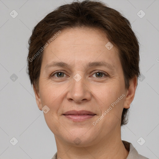 Joyful white adult female with short  brown hair and brown eyes