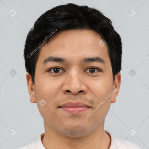 Joyful latino young-adult male with short  brown hair and brown eyes