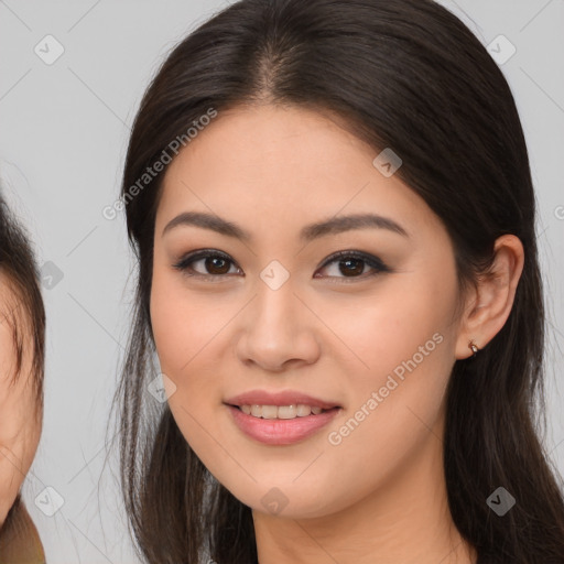 Joyful white young-adult female with long  brown hair and brown eyes