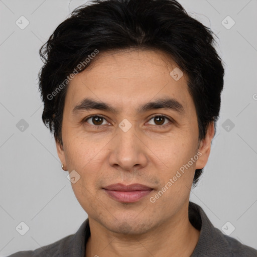 Joyful white adult male with short  black hair and brown eyes