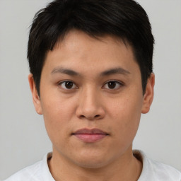 Neutral asian young-adult male with short  brown hair and brown eyes