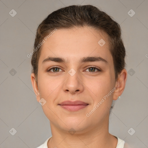 Joyful white young-adult female with short  brown hair and brown eyes