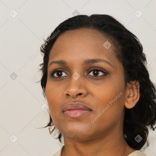 Joyful black young-adult female with medium  black hair and brown eyes