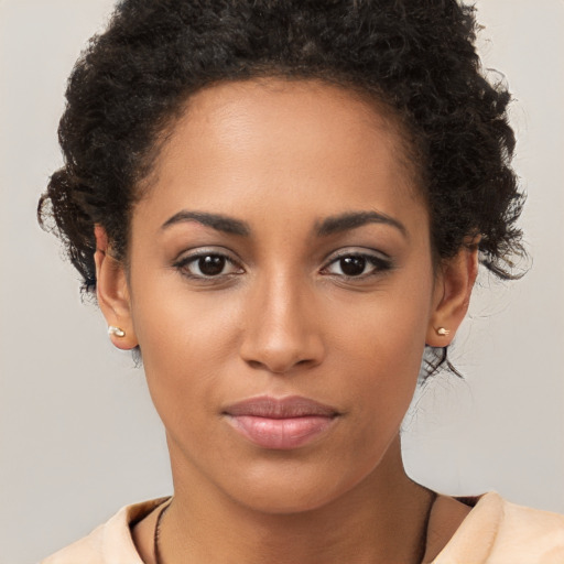 Joyful latino young-adult female with short  brown hair and brown eyes