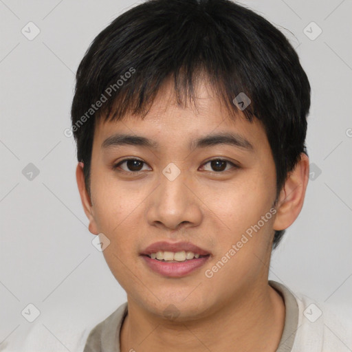 Joyful asian young-adult male with short  black hair and brown eyes