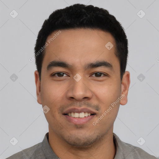 Joyful asian young-adult male with short  black hair and brown eyes