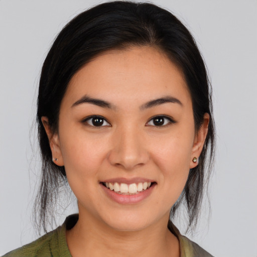 Joyful white young-adult female with medium  black hair and brown eyes