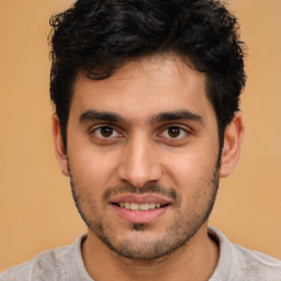 Joyful white young-adult male with short  black hair and brown eyes