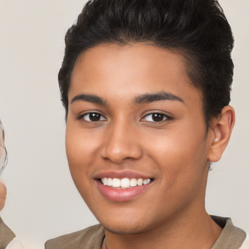 Joyful latino young-adult female with short  brown hair and brown eyes