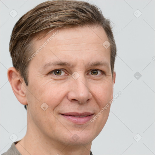 Joyful white adult male with short  brown hair and grey eyes