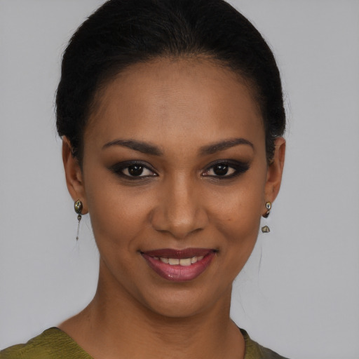 Joyful black young-adult female with short  brown hair and brown eyes