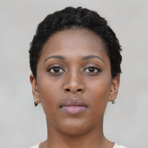 Neutral black young-adult female with short  brown hair and brown eyes