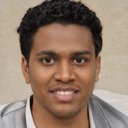 Joyful latino young-adult male with short  brown hair and brown eyes