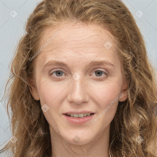 Joyful white adult female with long  brown hair and grey eyes