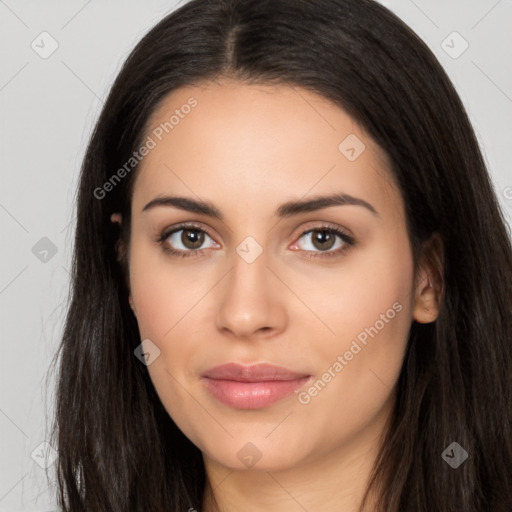 Joyful latino young-adult female with long  brown hair and brown eyes