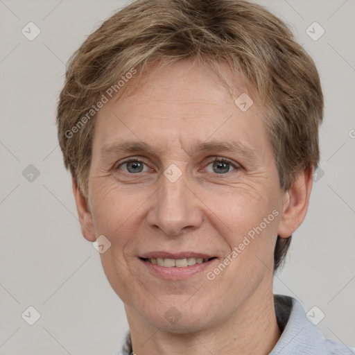 Joyful white adult male with short  brown hair and grey eyes