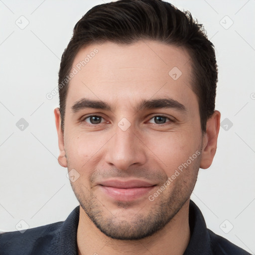 Joyful white young-adult male with short  brown hair and brown eyes