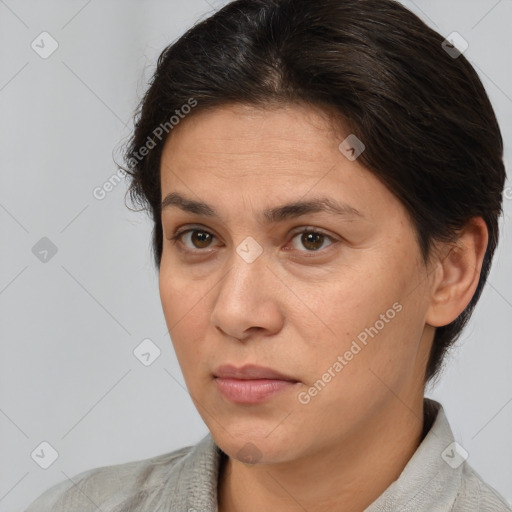 Joyful white adult female with short  brown hair and brown eyes