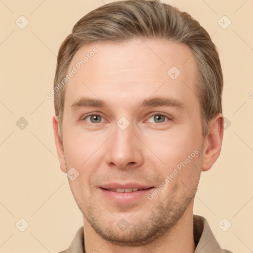 Joyful white young-adult male with short  brown hair and grey eyes