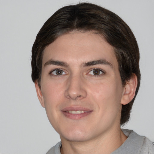 Joyful white young-adult male with medium  brown hair and brown eyes