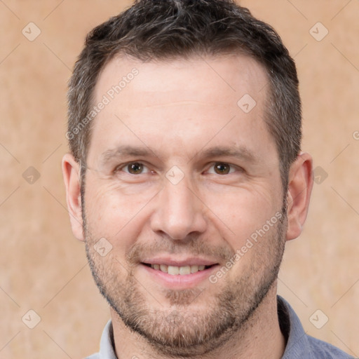 Joyful white adult male with short  brown hair and brown eyes