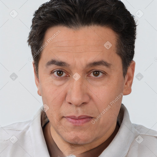 Joyful white adult male with short  brown hair and brown eyes