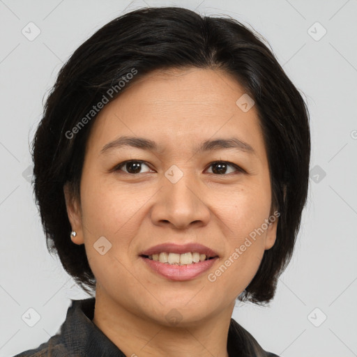 Joyful asian adult female with medium  brown hair and brown eyes