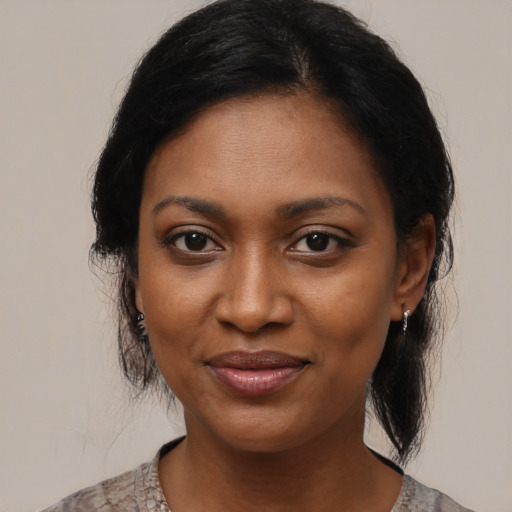Joyful black young-adult female with medium  black hair and brown eyes