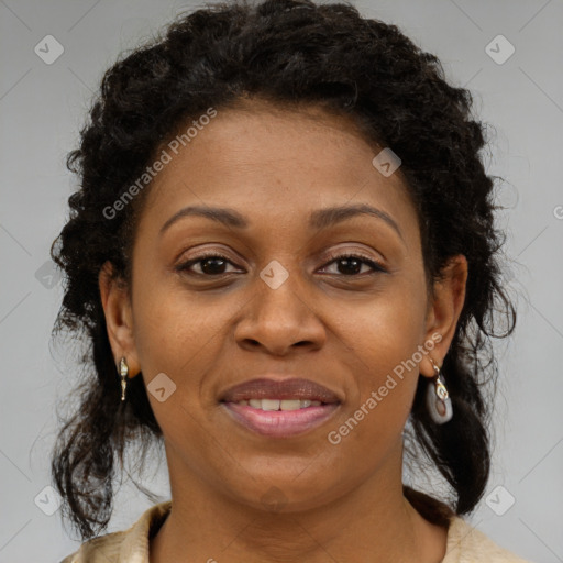 Joyful black adult female with medium  brown hair and brown eyes