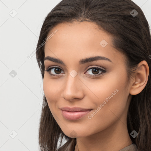 Joyful latino young-adult female with long  brown hair and brown eyes